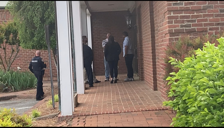 Police officers responded to a verbal altercation between Durham philanthropist Courtney Jordan (right) and at-large commissioner candidate James "Jay" Underwood.